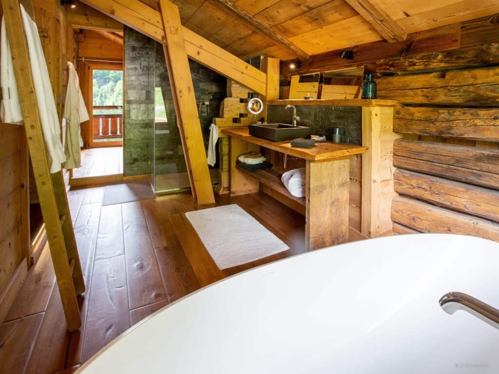 A bathroom with a wooden design sink
