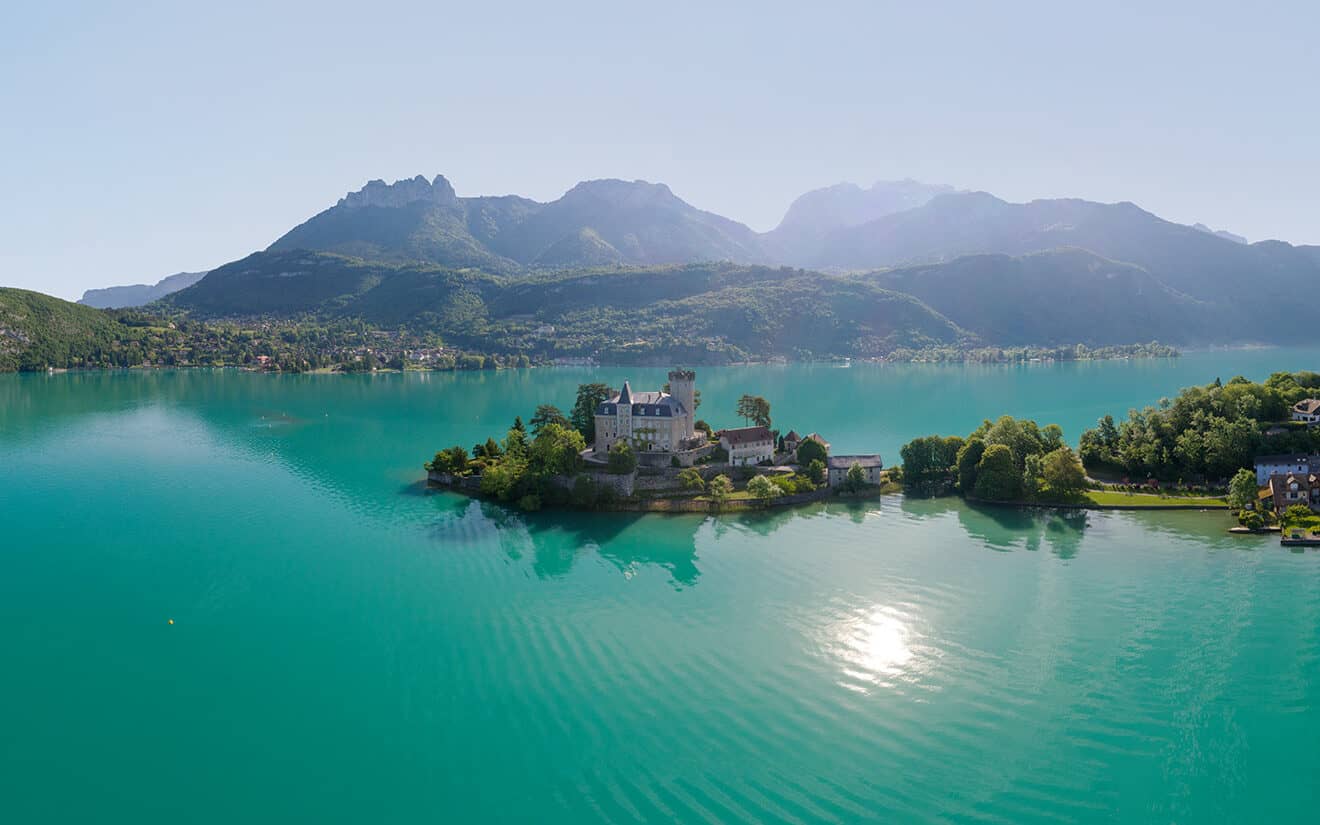 The impressive Chateau Duingt on a promontory in Lake Annecy