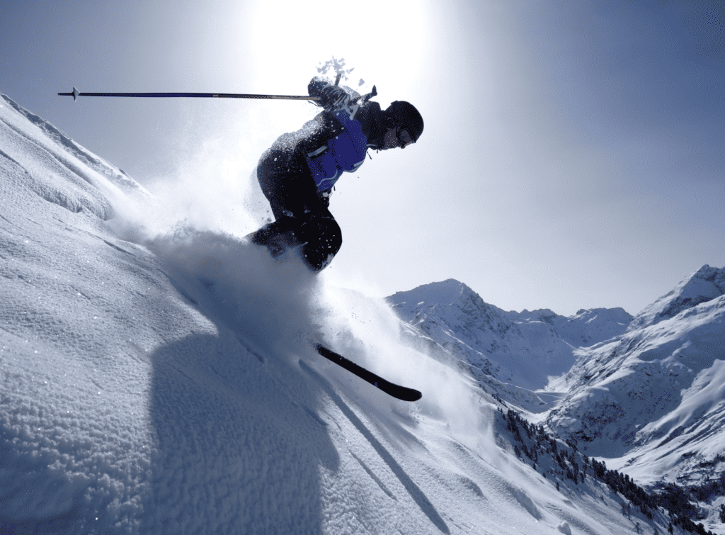 A skier on a steep descent
