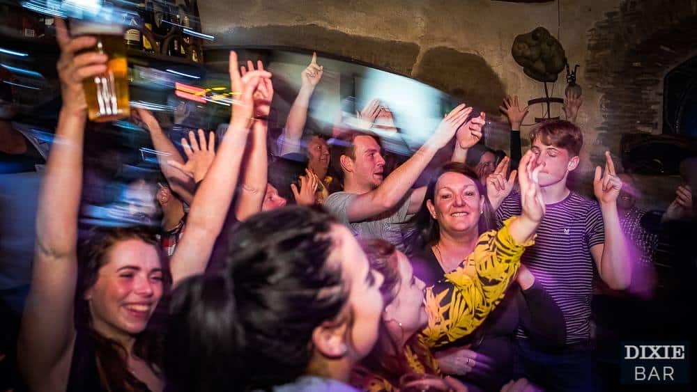People dance in the crowd at Dixie Bar Morzine