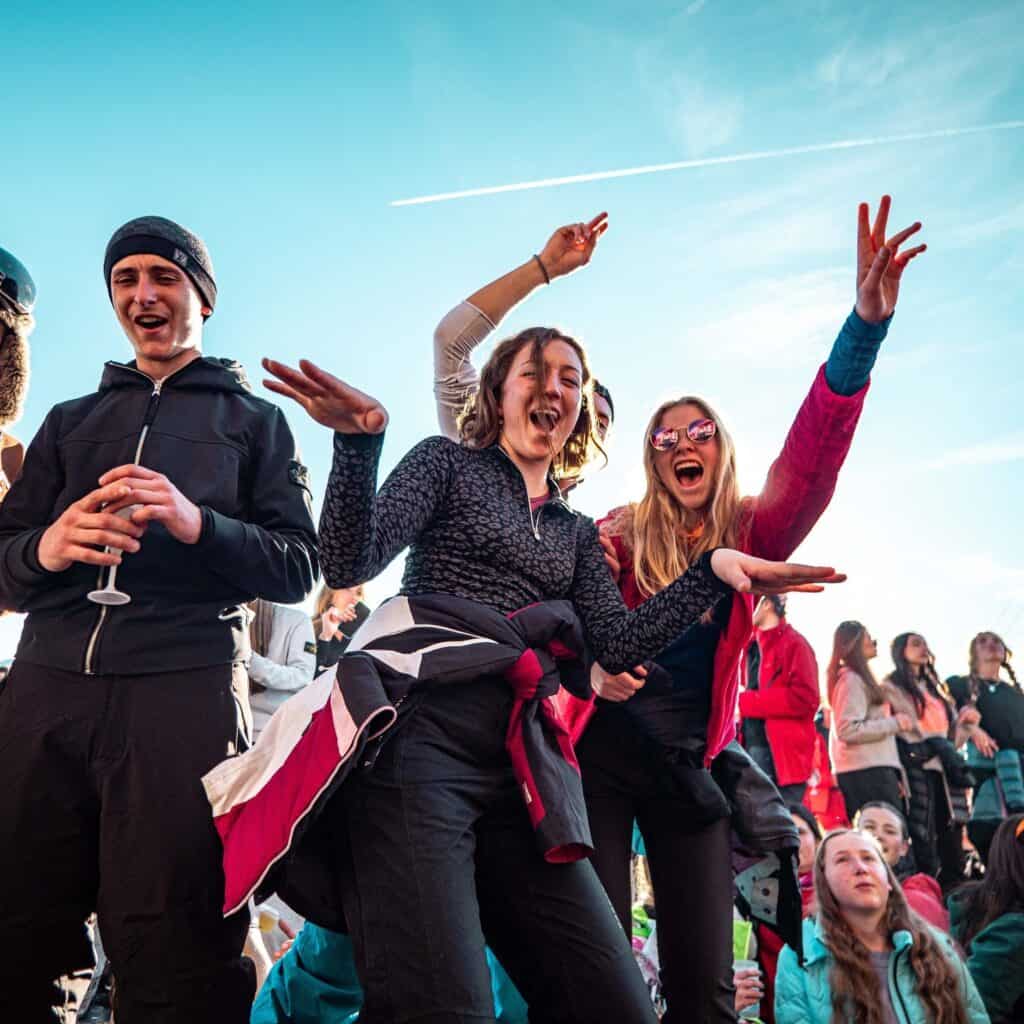People dance on tables at La Folie Douce