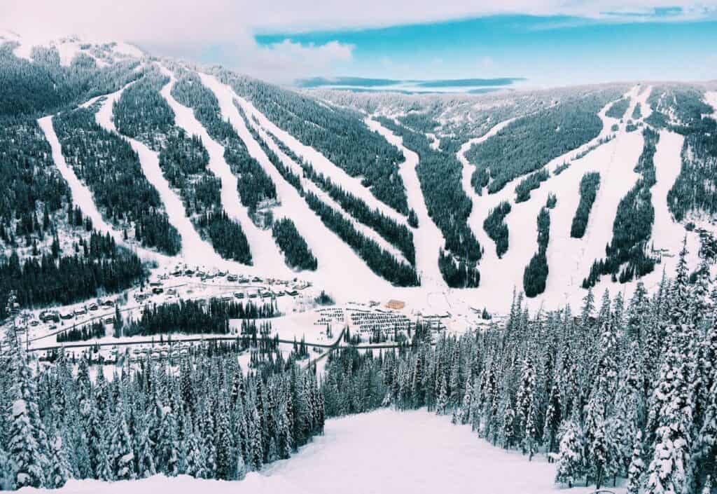 ski slopes run down the mountains towards a lift station