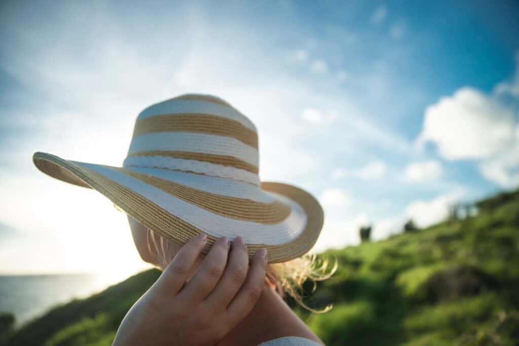 A woman wearing a straw sun hat
