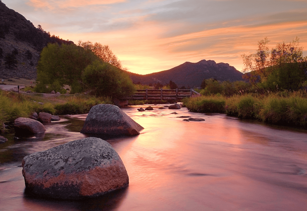 Sunset over a river in the mountains in the autumn