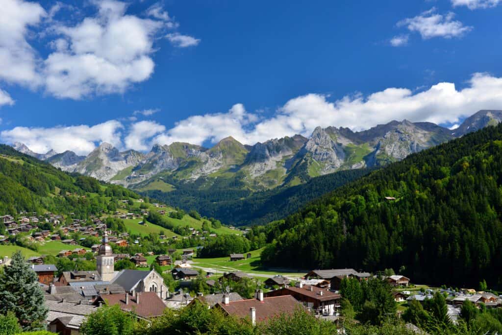 A view over the village of Le Grand Bornand, with mountains in the background