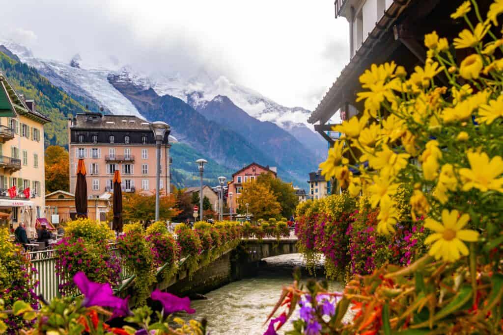 The mountain town of Chamonix with flowers along the river