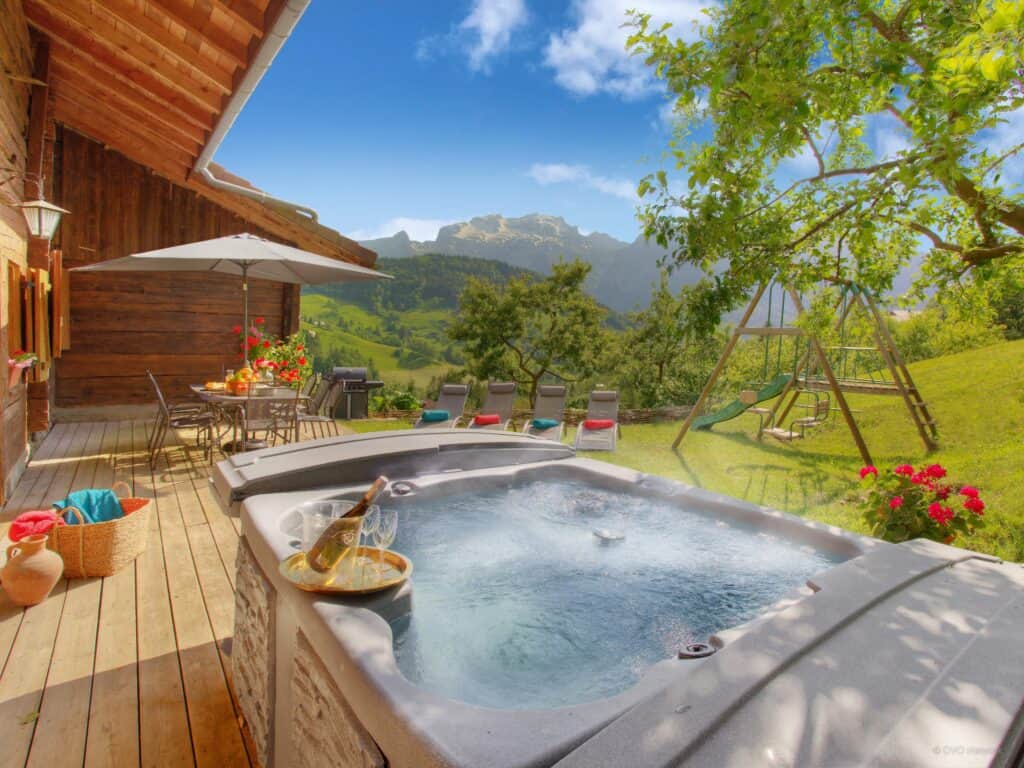 Hot tub with sunny garden and decking