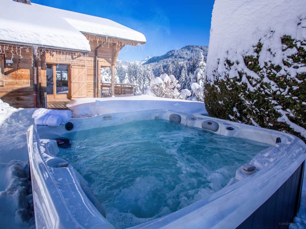 Winter hot tub with mountain views