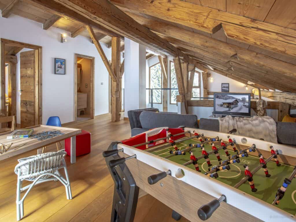 Table football and workspace in a rustic chalet