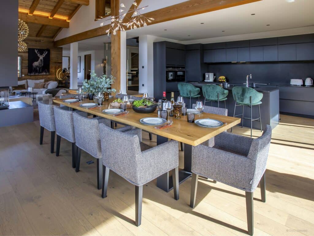 Modern dining room with tableware and comfortable seats