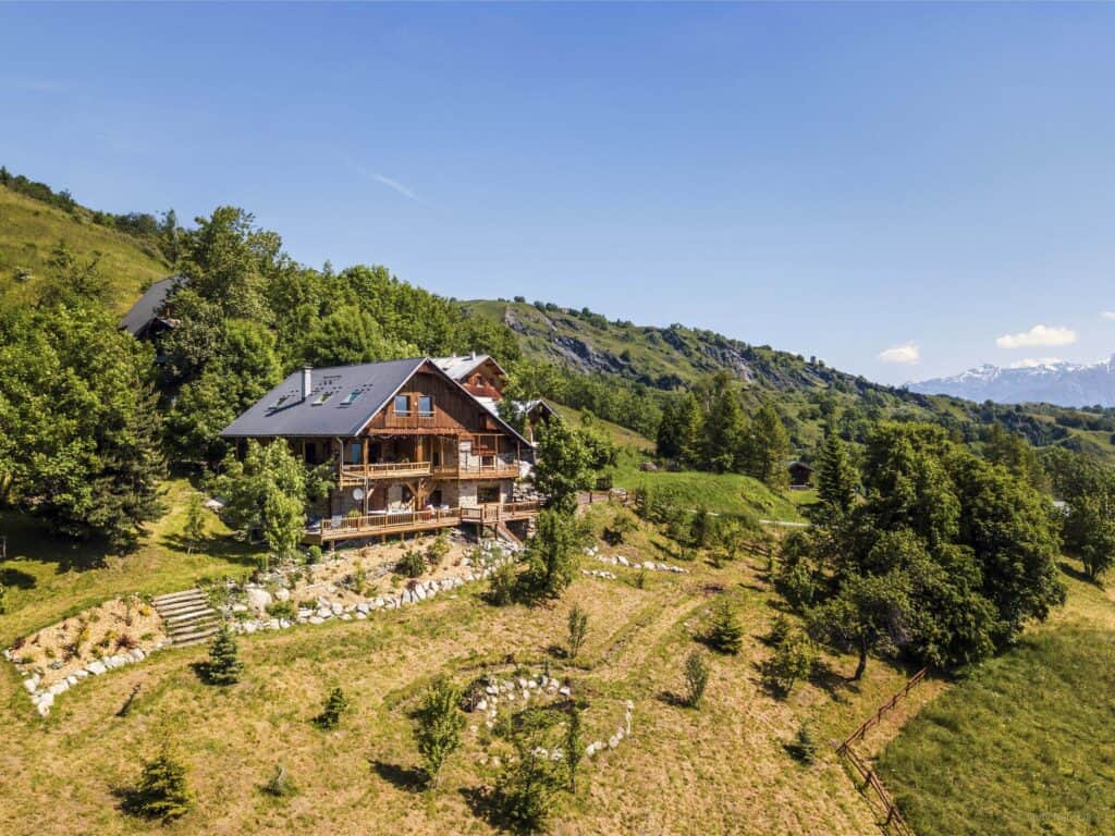 Secluded mountain Aibnb with green woodland and blue skies