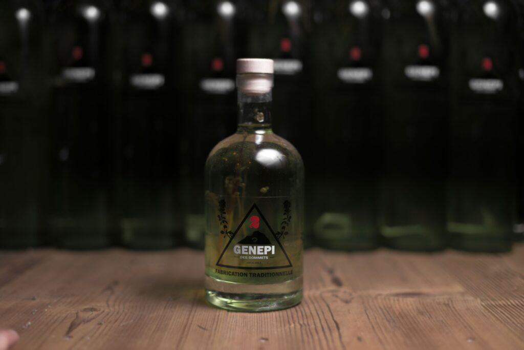 A bottle of genepi on a wooden table