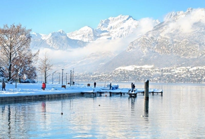 Lake Annecy, surrounded by snowy mountains