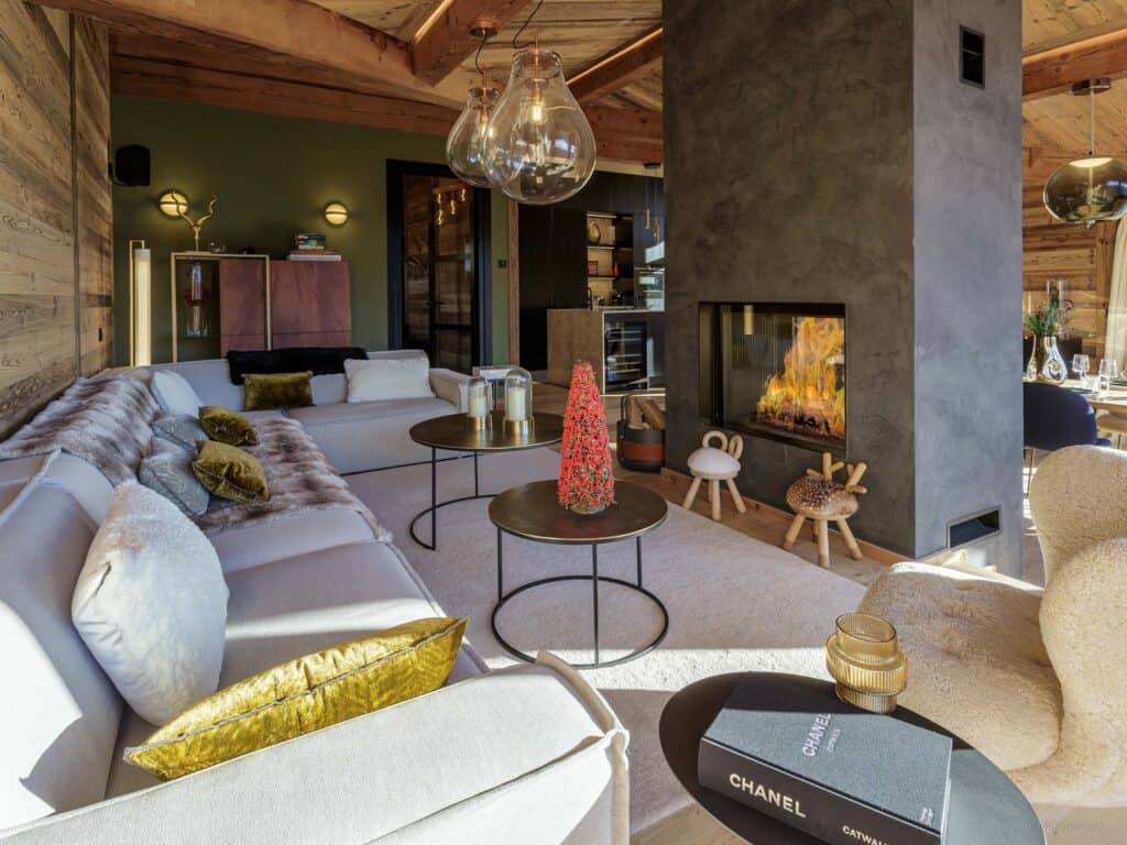 A modern living room with fireplace and dark features