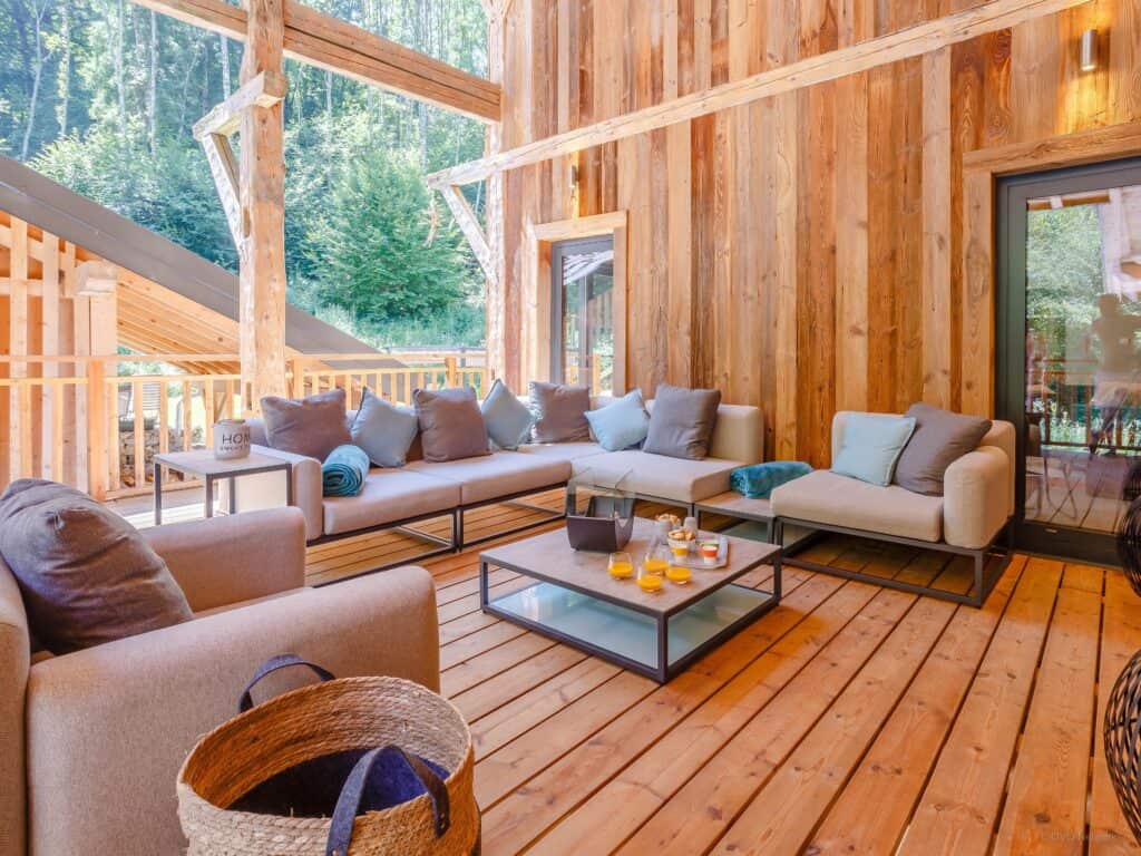 The terrace of this chalet is furnished to look like an outdoor living room