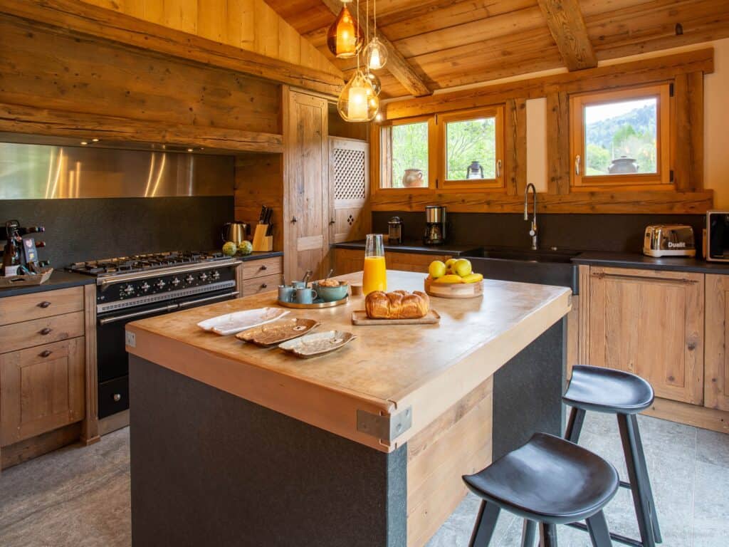 A rustic  wooden kitchen with a central island