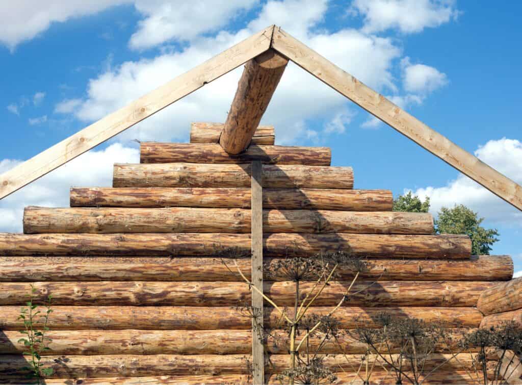 A rustic wooden building under construction