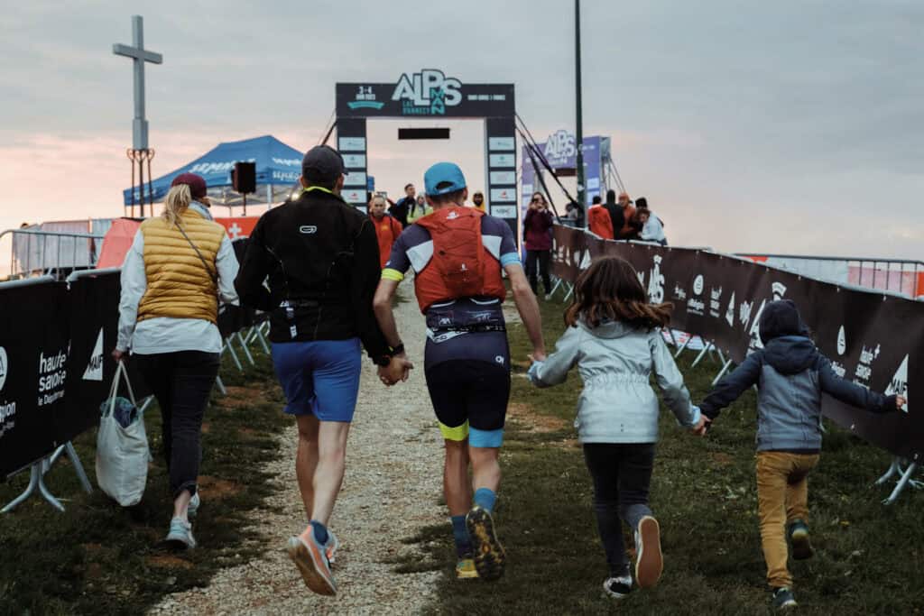 Runners approach the finish line of the AlpsMan challenge